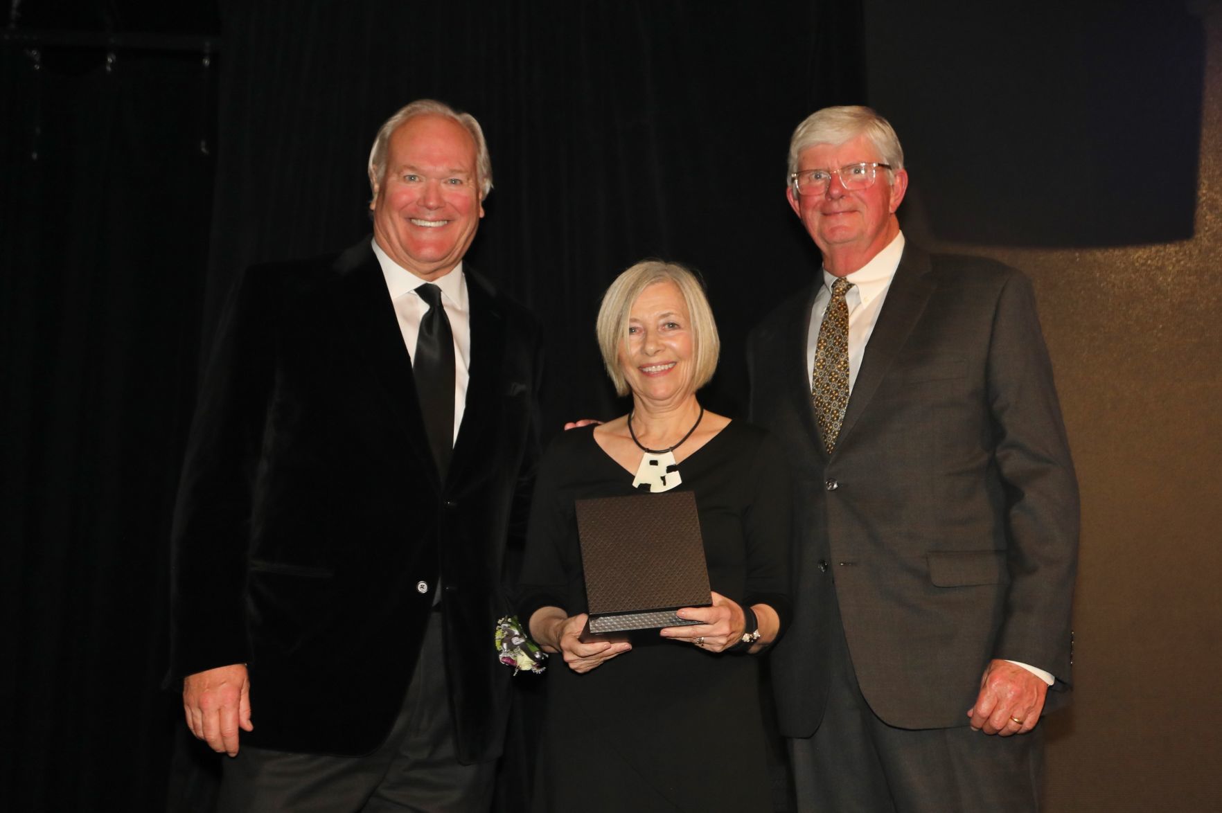 Dick Miles, Chairman of the Board, Cynthia Russell, daughter of late father Willard Boyle, honoree, Bob Bishop, chair of induction committee and board member